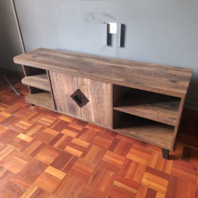 A BROWN, EXQUISITE WOODEN TV STAND ON SALE.