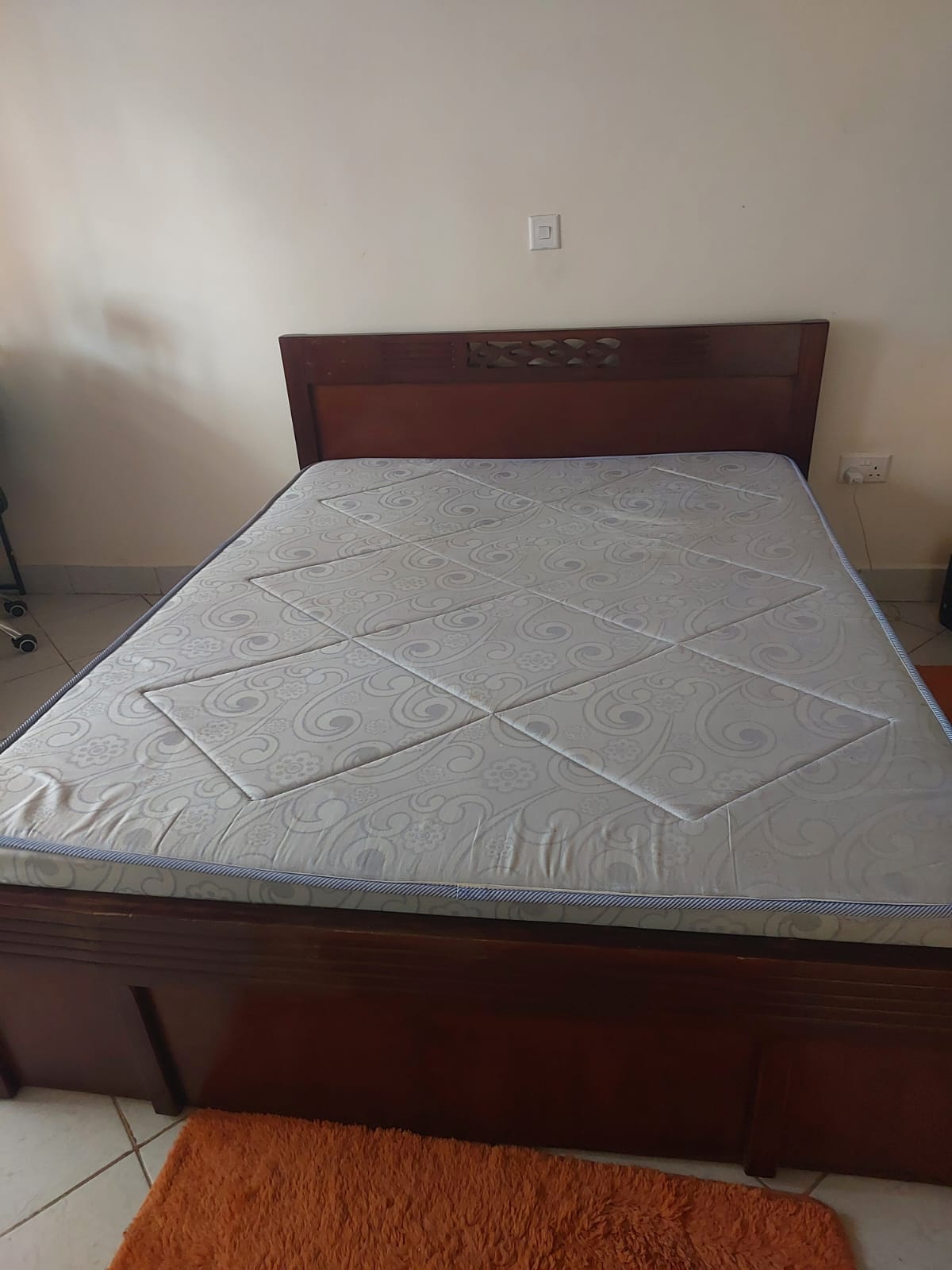 BROWN 5 BY 6 BED AND MATTRESS