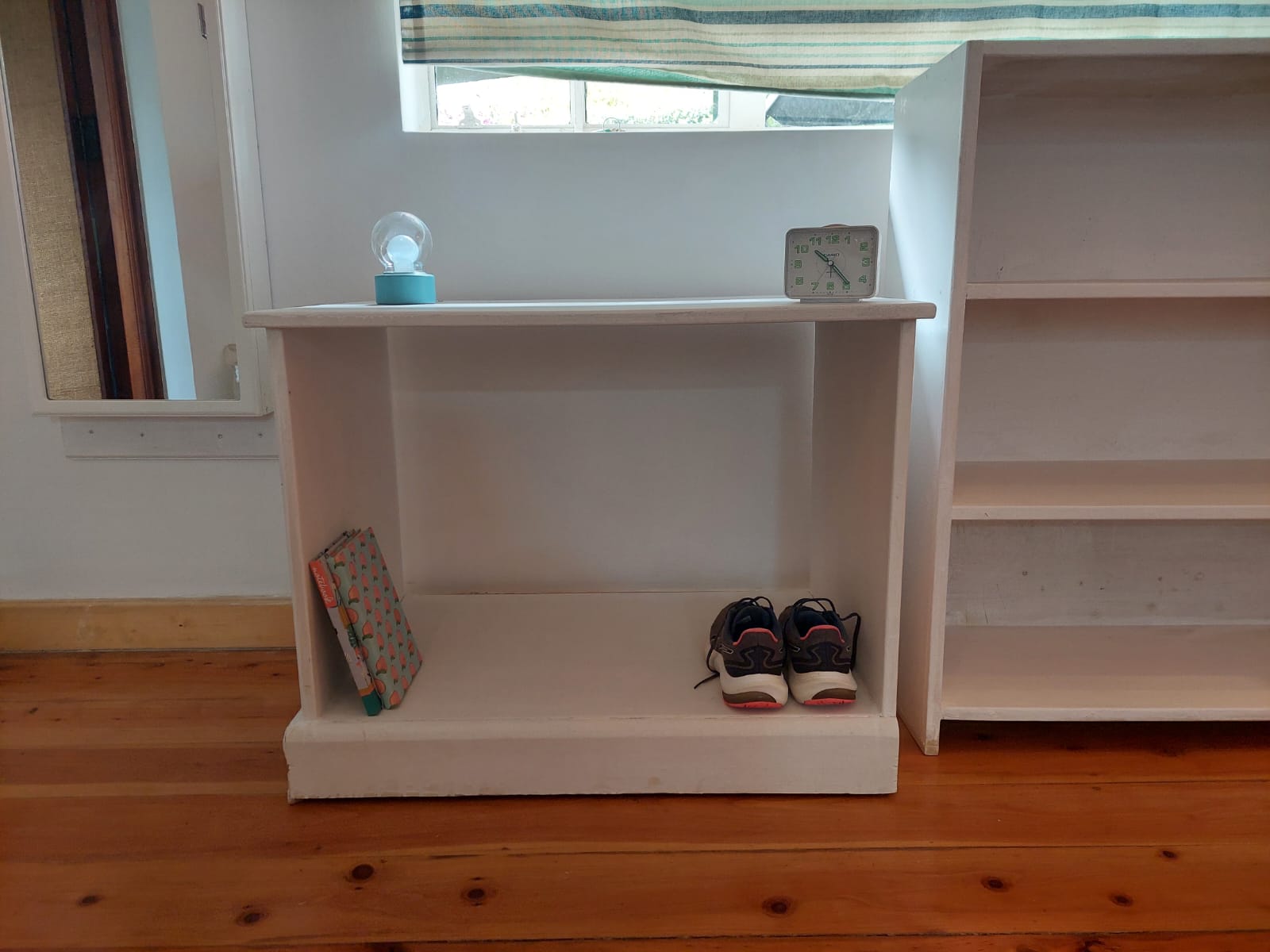 A low wooden storage shelf on Sale