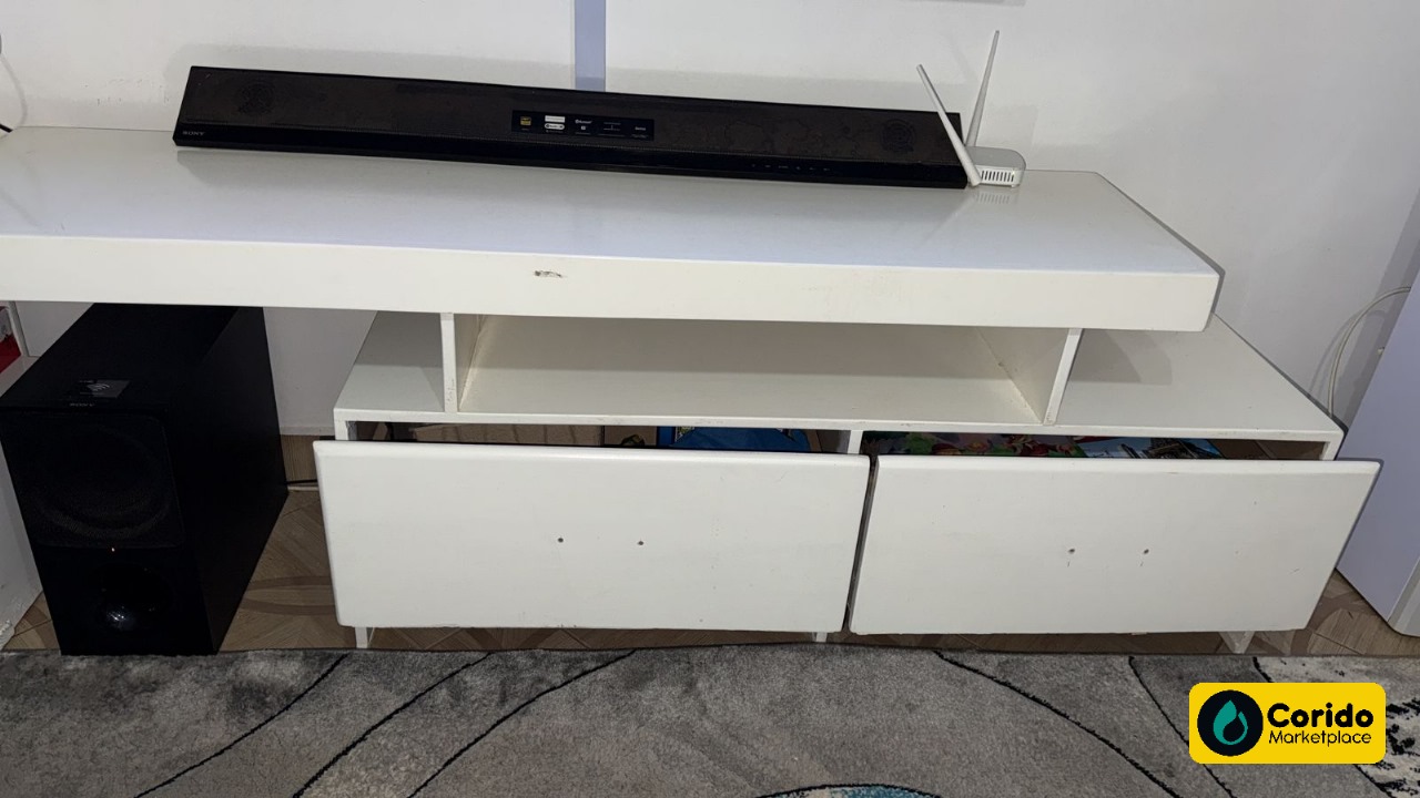 Clean, White TV Stand with 2 Shelves and Cabinets