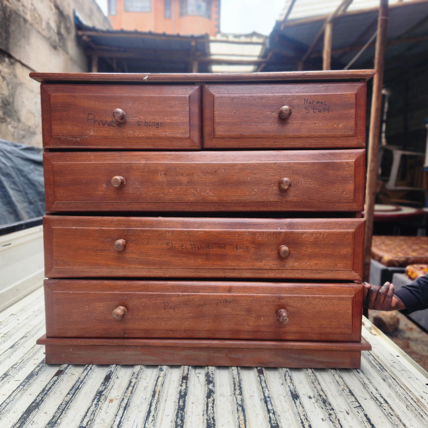 Brown wooden chest of drawers