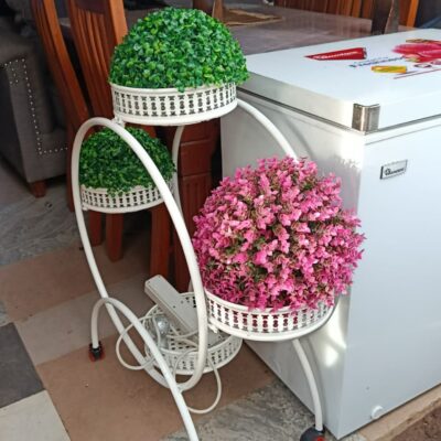 Multi-layered metal plant stand and artificial flower topiary balls