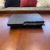 PLAYSTATION 3 CONSOLE, 2 DUALSHOCK 3 CONTROLLERS, 3 PS3 GAMES